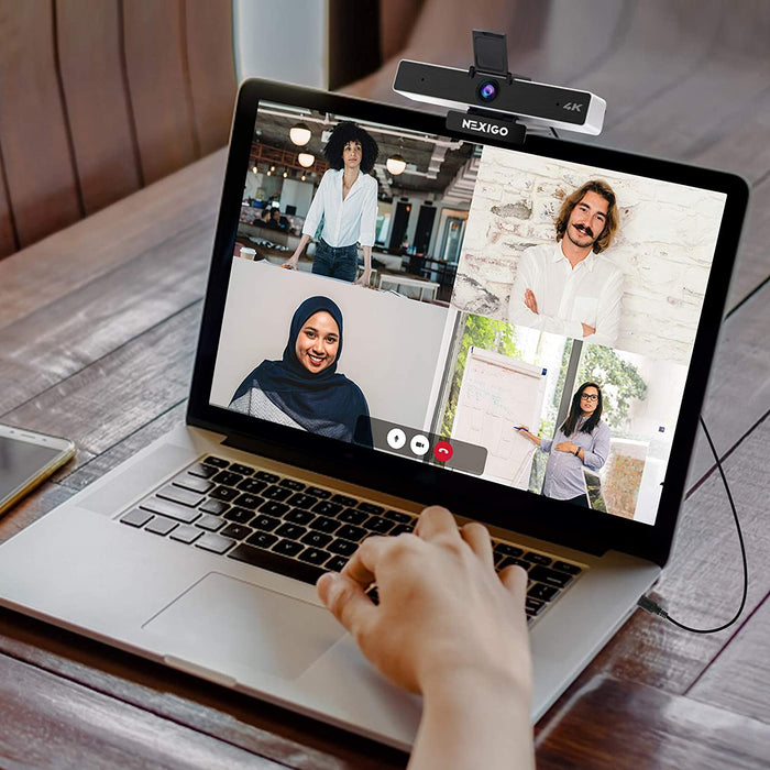 A person is using a 4K webcam for a multi-person video conference.