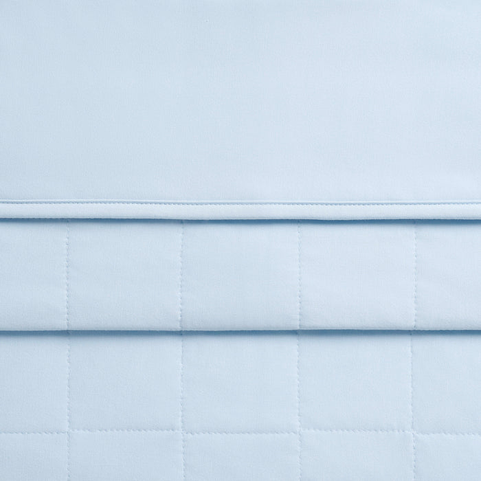 Close up of the Toddler Blanket in Breeze 1.0 showing the quilted backing and smooth fabric top