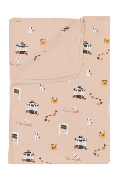 Beige blanket with Gilmore Girls pattern on a white background