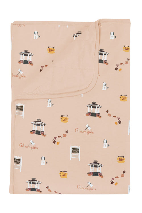 Beige blanket with Gilmore Girls pattern on a white background